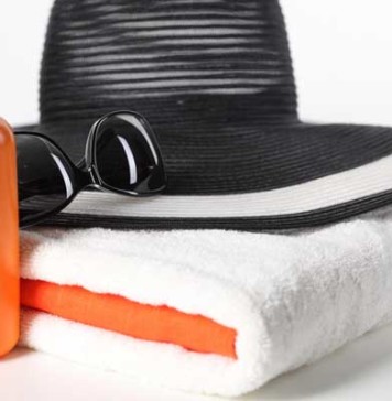 Sun Creams Slow Down Skin Aging hat, towel, sun cream, sunglasses